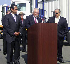 TTSI president Victor La Rosa (center), alongside mayors Antonio Villaraigosa (left) and Bob Foster (right), jump-starts the Green Truck Initiative with his announcement of TTSI’s 12 month program to replace dirty diesel freight trucks with a totally green truck fleet.