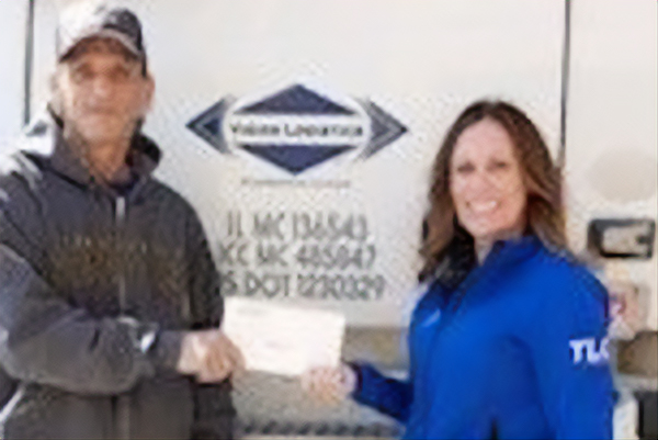 Chris Wegner, our third “Top Dog” recipient, getting his $250 check presented by Stacey Gibson from TLC